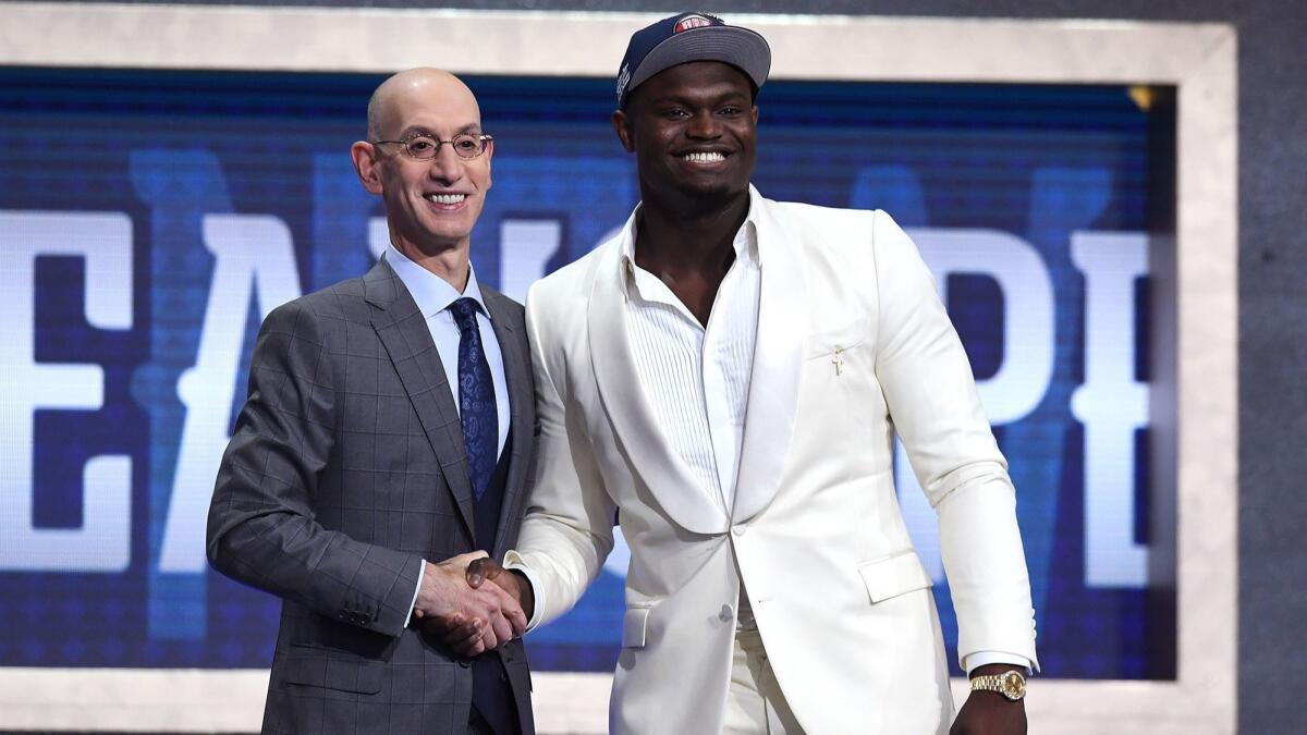Zion Williamson poses with NBA commissioner Adam Silver after being drafted as the first overall pick by the New Orleans Pelicans during the NBA draft in New York on Thursday.
