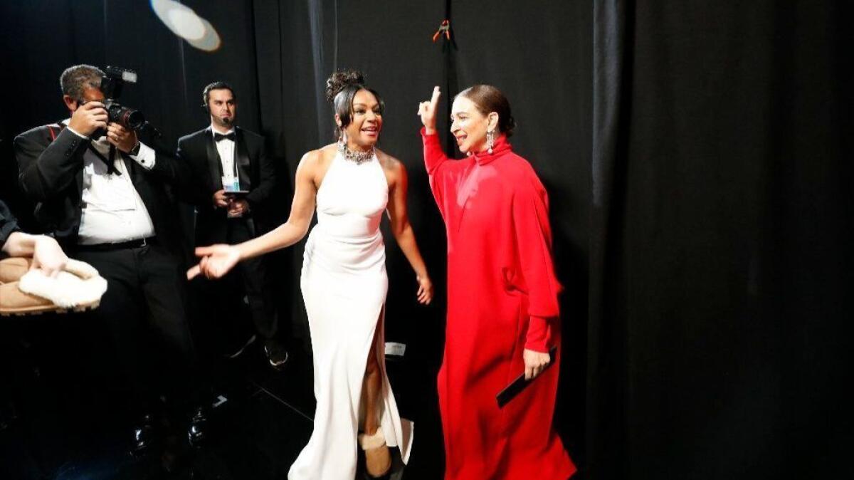 Tiffany Haddish, left, and Maya Rudolph backstage before presenting at the 90th Academy Awards.