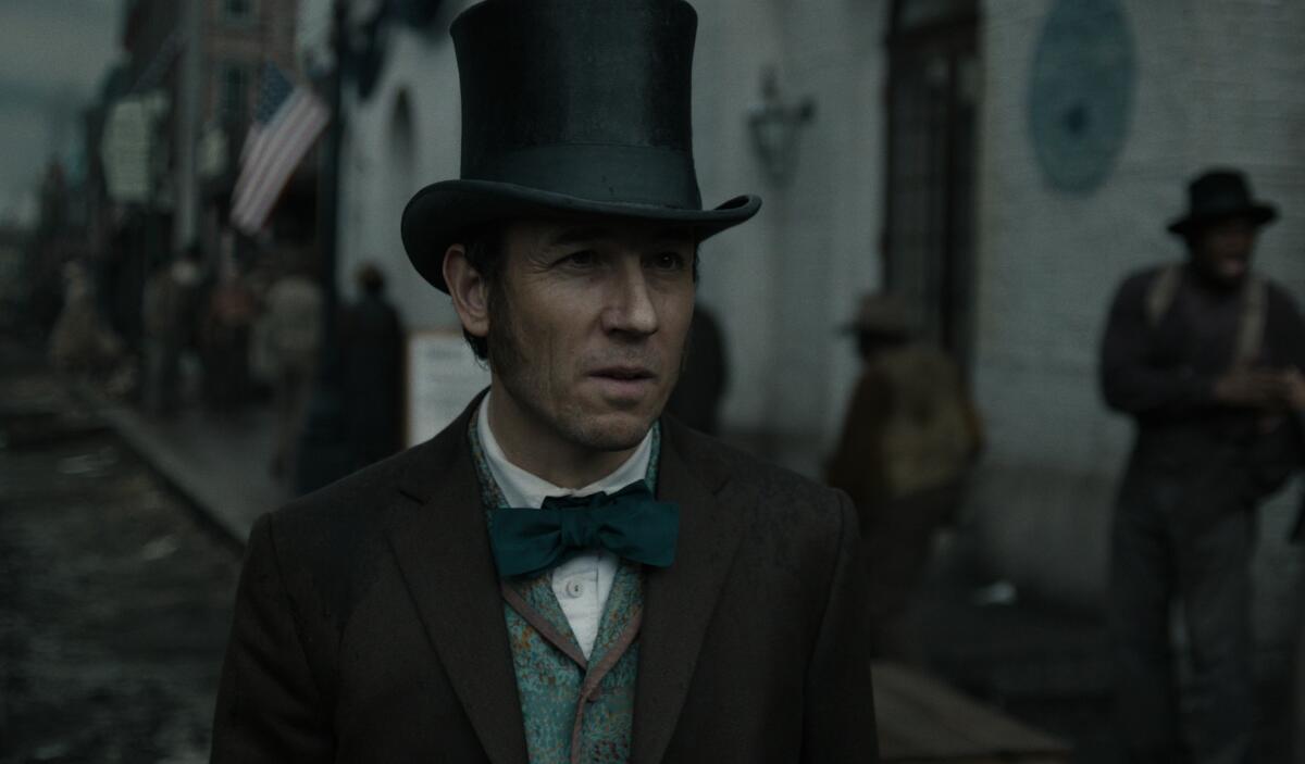 Tobias Menzies, in tophat and bowtie, in "Manhunt." 