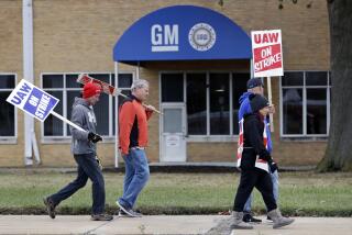 General Motors employees picket outside the General Motors Fabrication Division, Wednesday, Oct. 16, 2019, in Parma, Ohio. Bargainers for General Motors and the United Auto Workers reached a tentative contract deal on Wednesday that could end a monthlong strike that brought the company's U.S. factories to a standstill. (AP Photo/Tony Dejak)