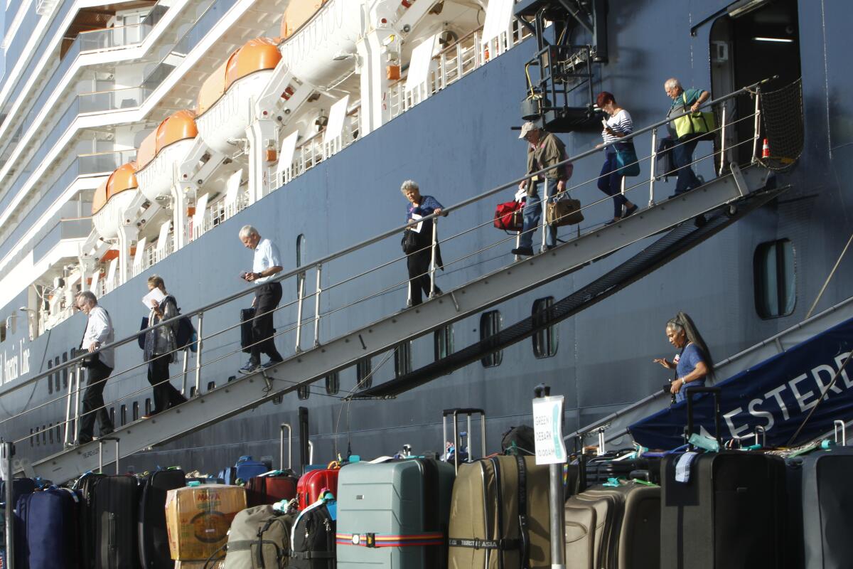 Westerdam cruise ship passengers disembark at the port of Sihanoukville, Cambodia, on Saturday.