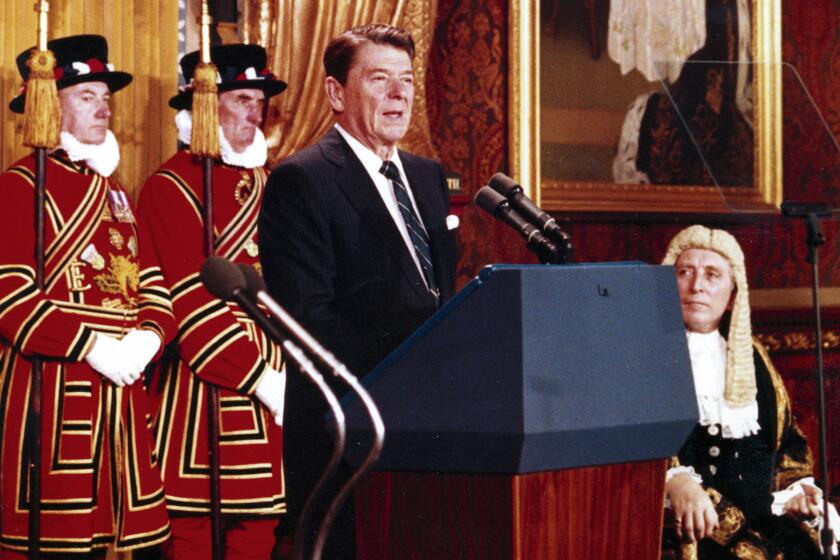 FILE - President Ronald Reagan, during a brief visit to London, June 8, 1982, makes his address to Britain's Houses of Parliament, in the Royal Gallery of the Palace of Westminster. As most Republican White House hopefuls gather Wednesday at Reagan’s presidential library for a debate, expect to hear more homages to the “Great Communicator.” (AP Photo/Pool, File)