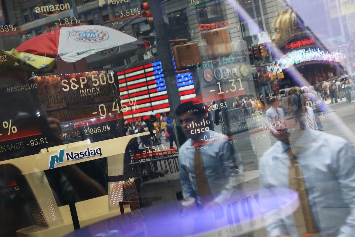 The Nasdaq MarketSite is reflected in a window in Times Square. Shares in Poshmark surged on their first day of trading.