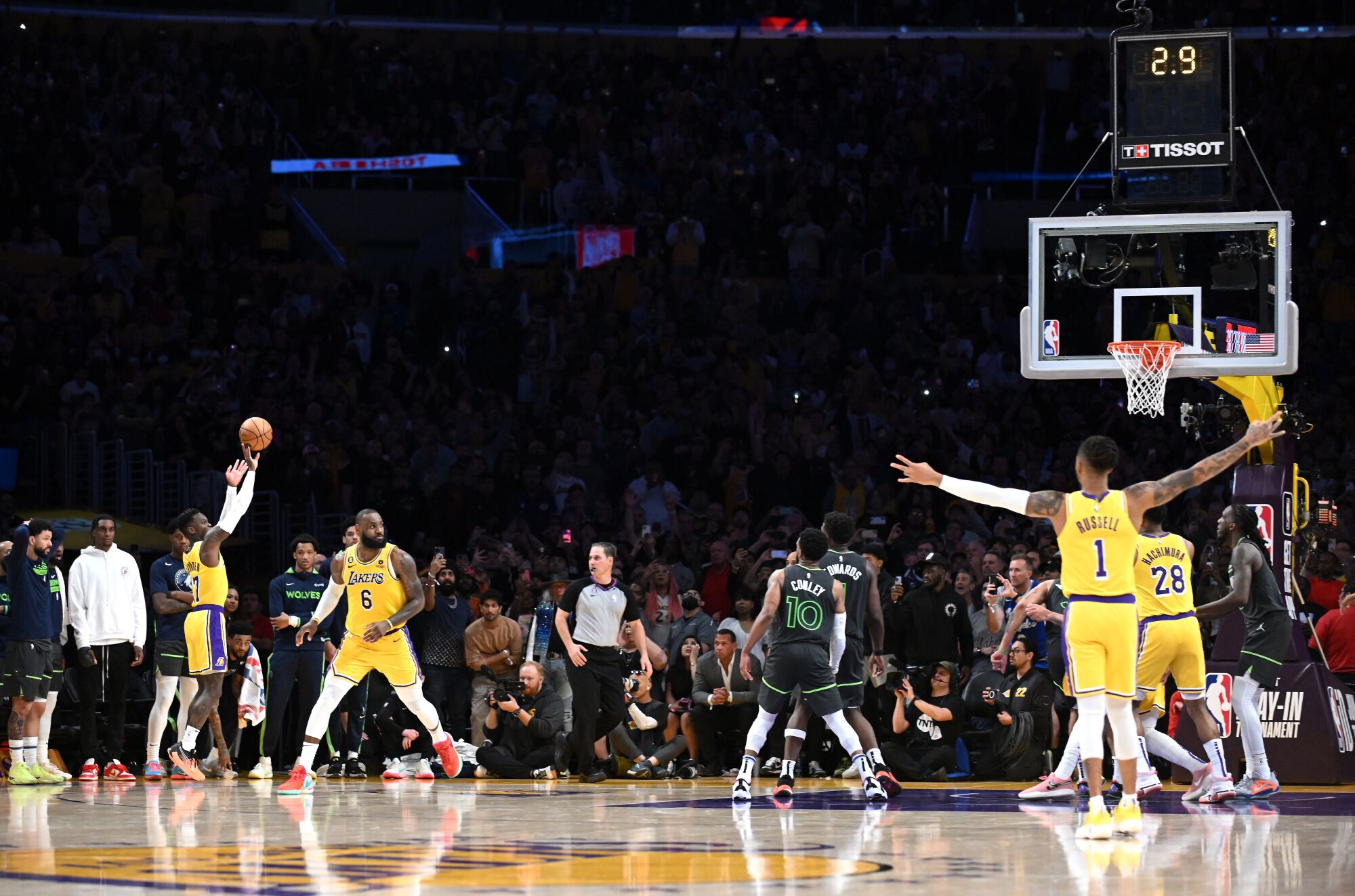 Lakers guard Dennis Schroder releases a three-pointer from the corner for a 98-95 lead late in the fourth quarter.