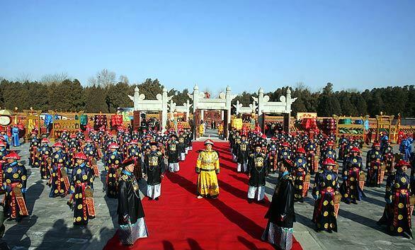 In Beijing, Li Shaohua, center, leads other performers in a reenactment of a Qing Dynasty ceremony to worship the Earth. Li, who is not a professional actor, was selected by residents to play the role of emperor.