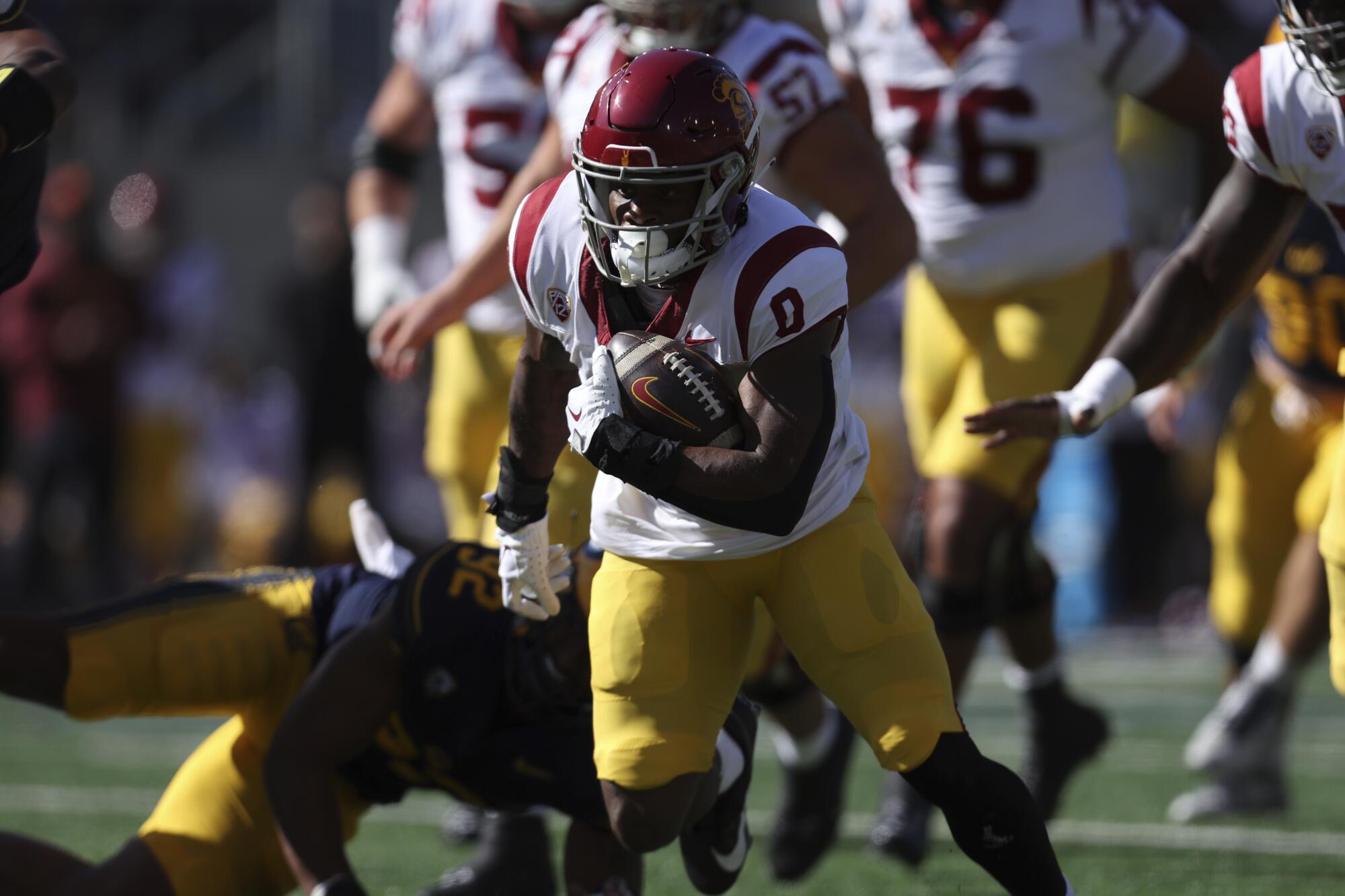 USC running back MarShawn Lloyd carries the ball during the first half against Cal.
