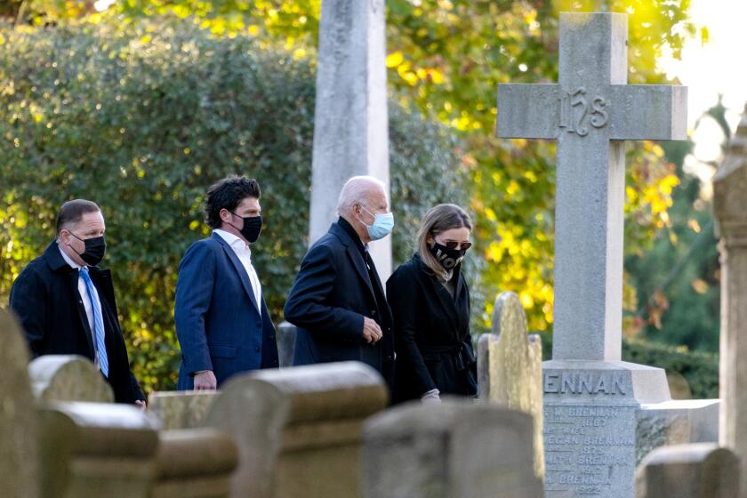 Democratic presidential candidate former Vice President Joe Biden walks with his granddaughter Finnegan Biden into St Joseph On the Brandywine Catholic Church in Wilmington, Del., Tuesday, Nov. 3, 2020. (AP Photo/Carolyn Kaster)