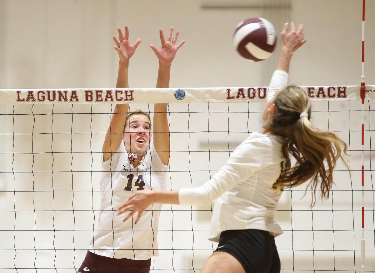Laguna Beach's Piper Naess (14) blocks the shot by Mira Costa's Amanda Burns in the first round of the CIF Southern Section Division 1 playoffs at home on Oct. 24.