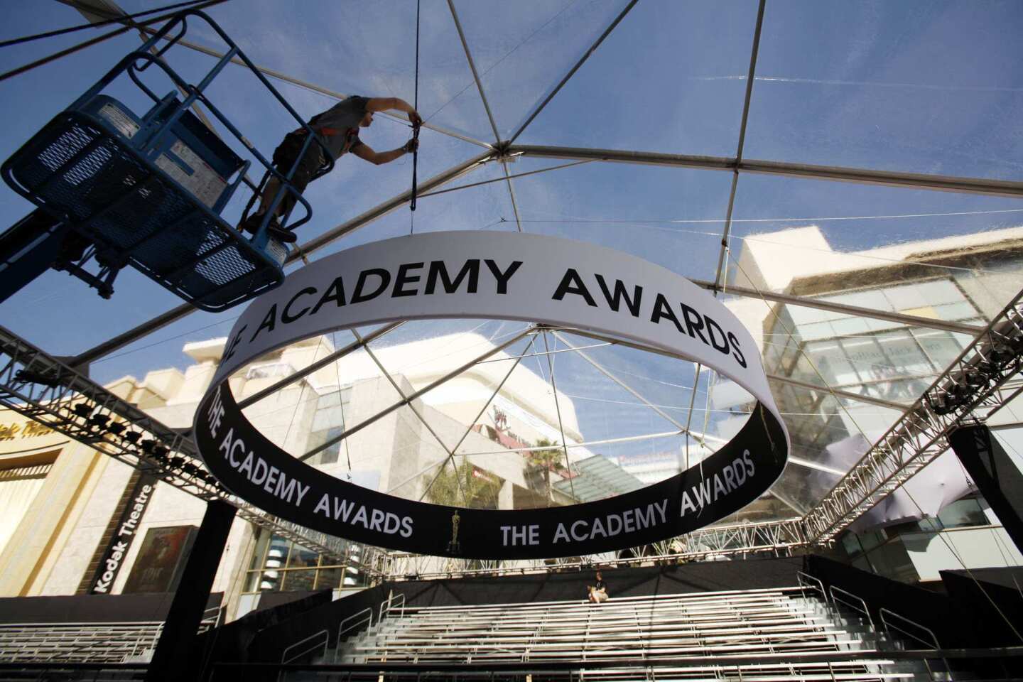 Chris Roseli works rigging as preparations continue on Hollywood Blvd in front of the Hollywood & Highland Center on Wednesday for the 84th Academy Awards on this coming Sunday.