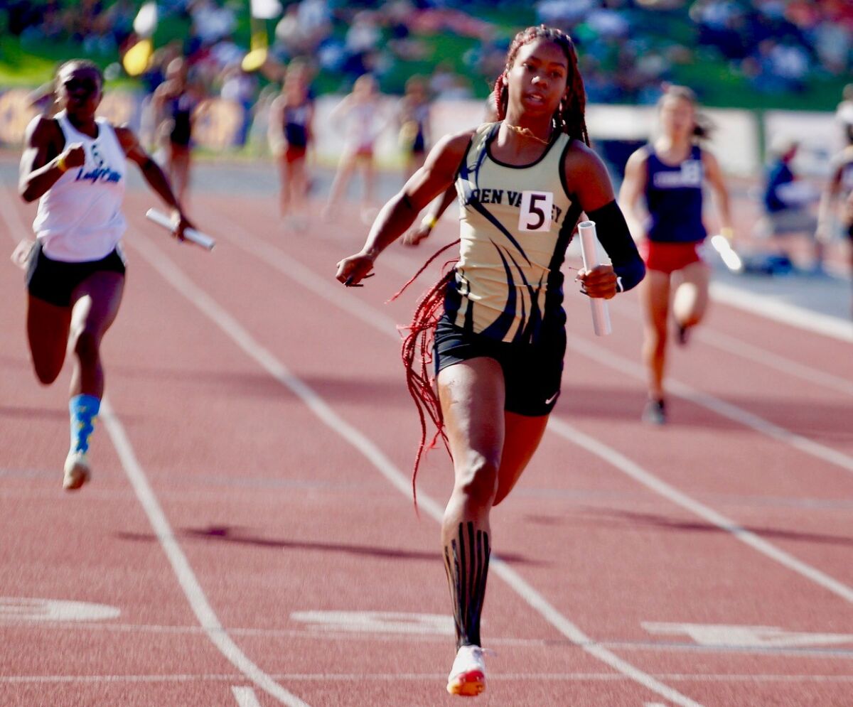 Golden Valley anchor runner Adonijah Currie crosses the finish line in the girls' 400 relay at state prelims in Clovis.