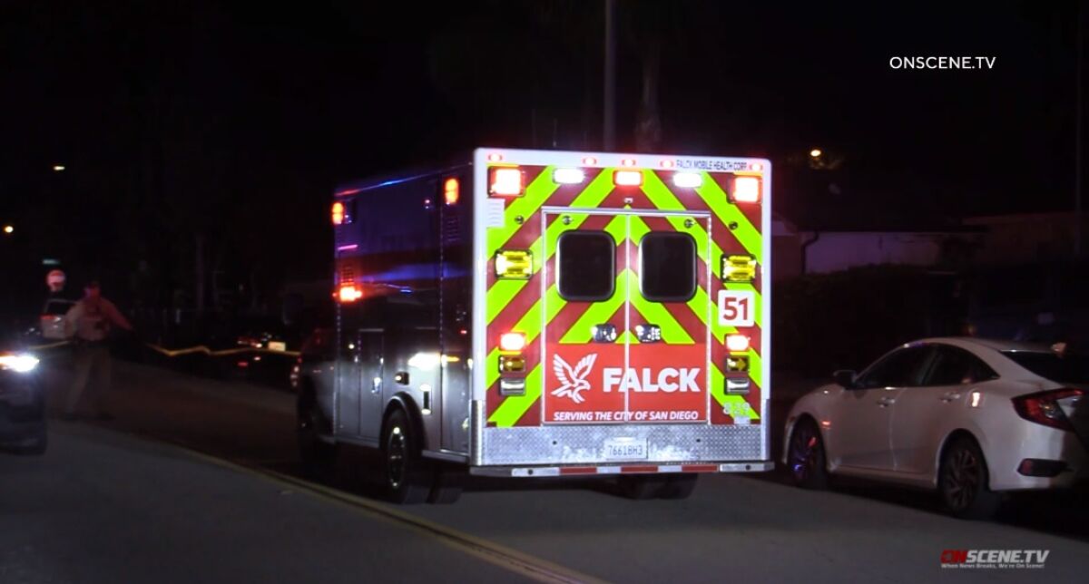 An ambulance carrying a homicide victim pulls away from the scene where the stabbing occurred in Jamacha-Lomita. 