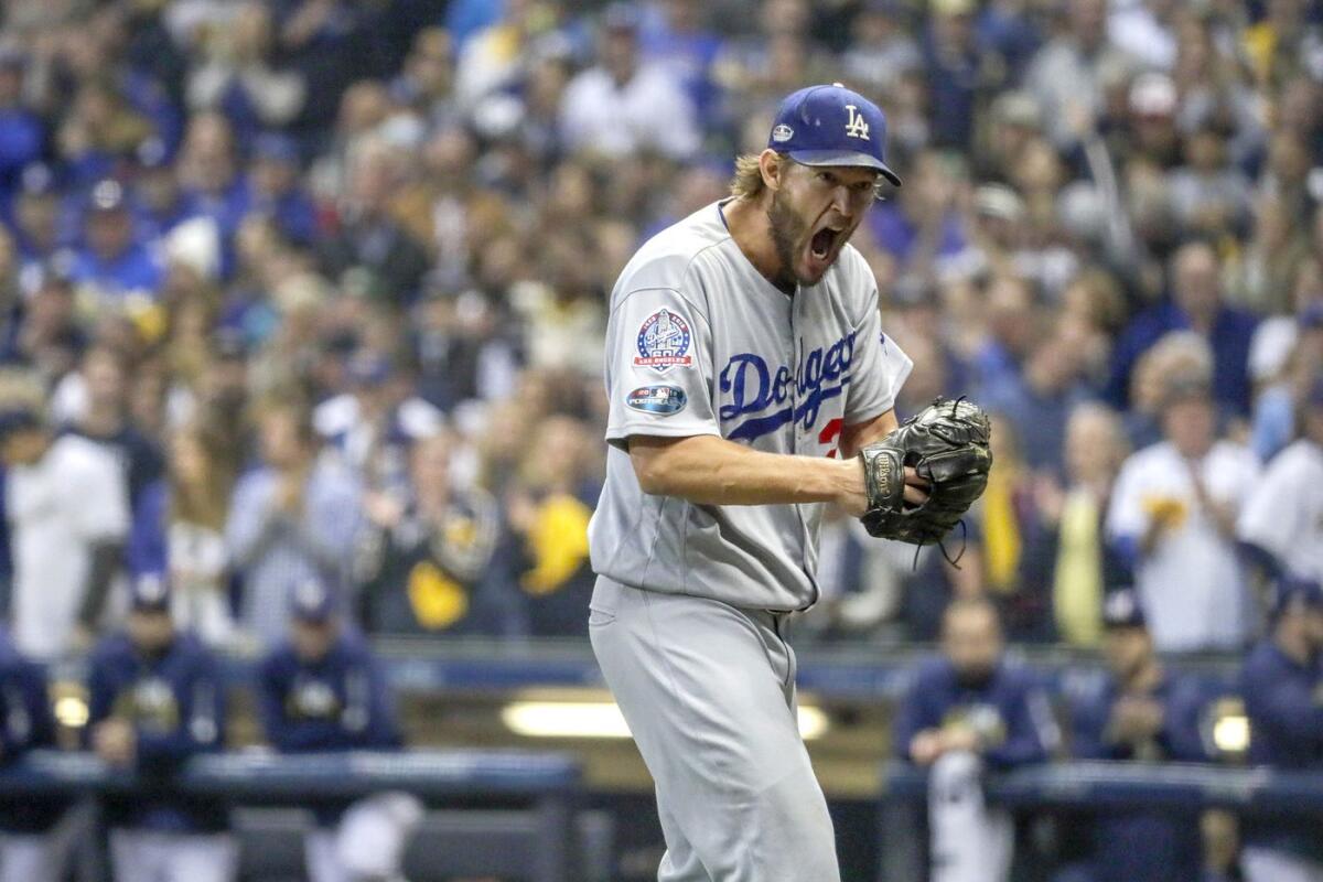 Clayton Kershaw lets out a howl after the Milwaukee Brewers scored two runs in the third inning of Game 1 of the NLCS.