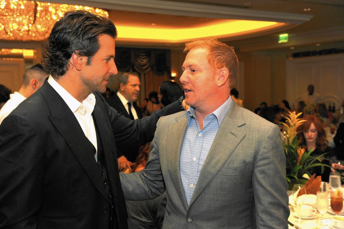 Actor Bradley Cooper, left, and Relativity Media chief Ryan Kavanaugh attend a Hollywood Foreign Press Assn. event in 2012.