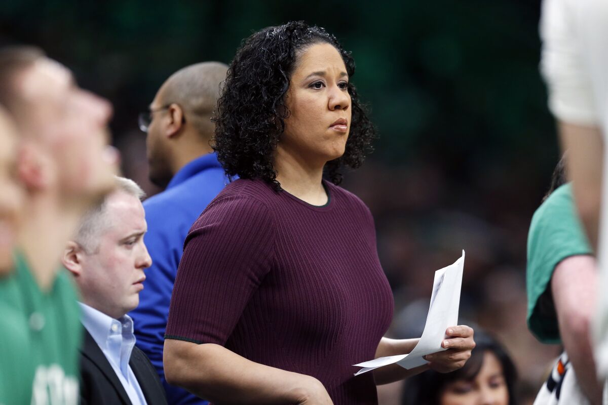 In this Dec. 28, 2019, photo, then-Boston Celtics assistant coach Kara Lawson watches during a game vs. the Toronto Raptors.
