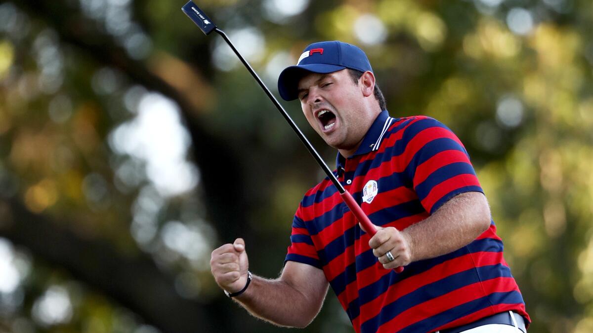 American Patrick Reed reacts after making a putt at No. 14 on Saturday.