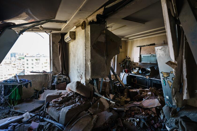 KYIV, UKRAINE -- FEBRUARY 26, 2022: A rocket hits a residential building as seen in Kyiv, Ukraine, Saturday, Feb. 26, 2022. (MARCUS YAM / LOS ANGELES TIMES)