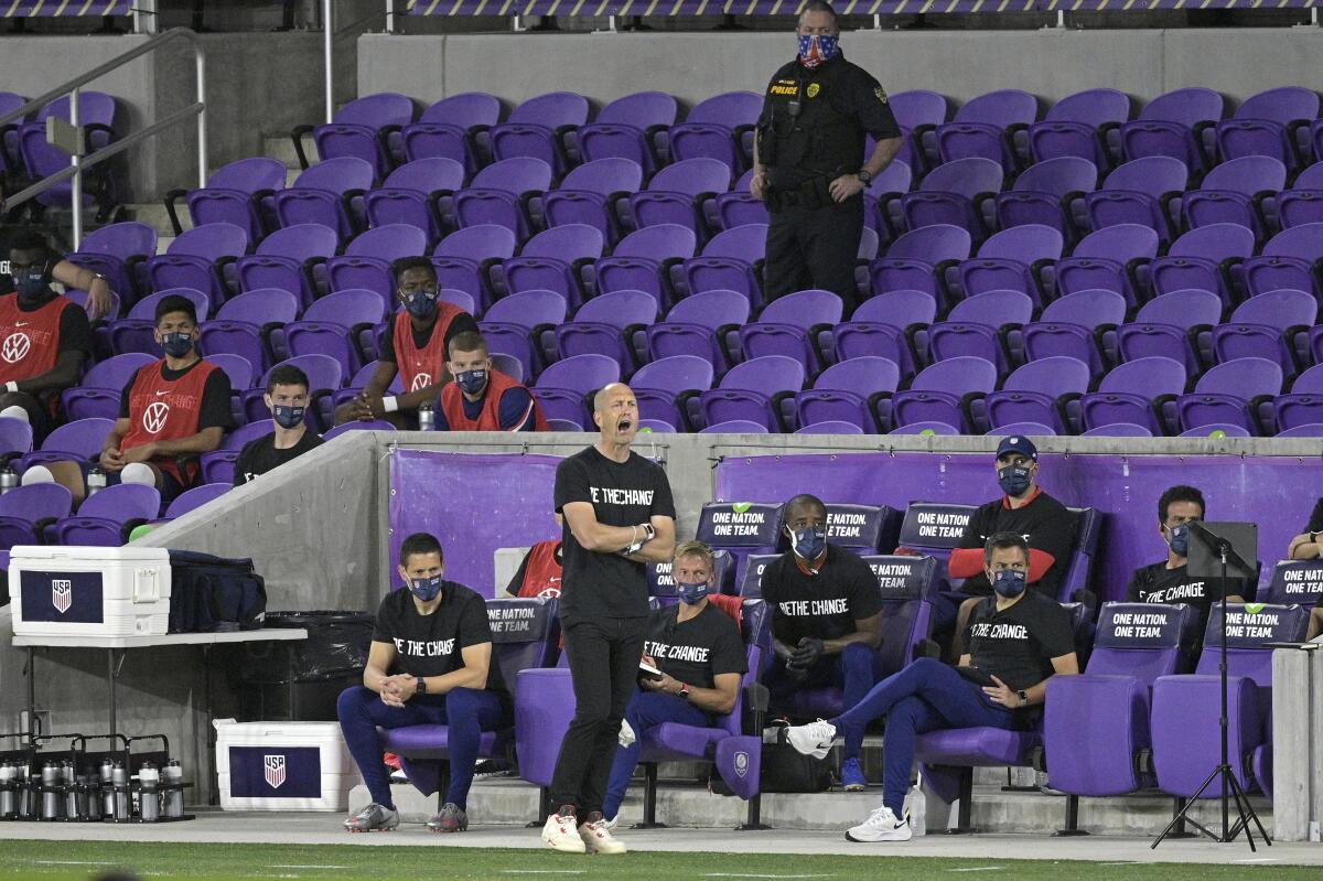 United States head coach Gregg Berhalter, center, calls out instructions 