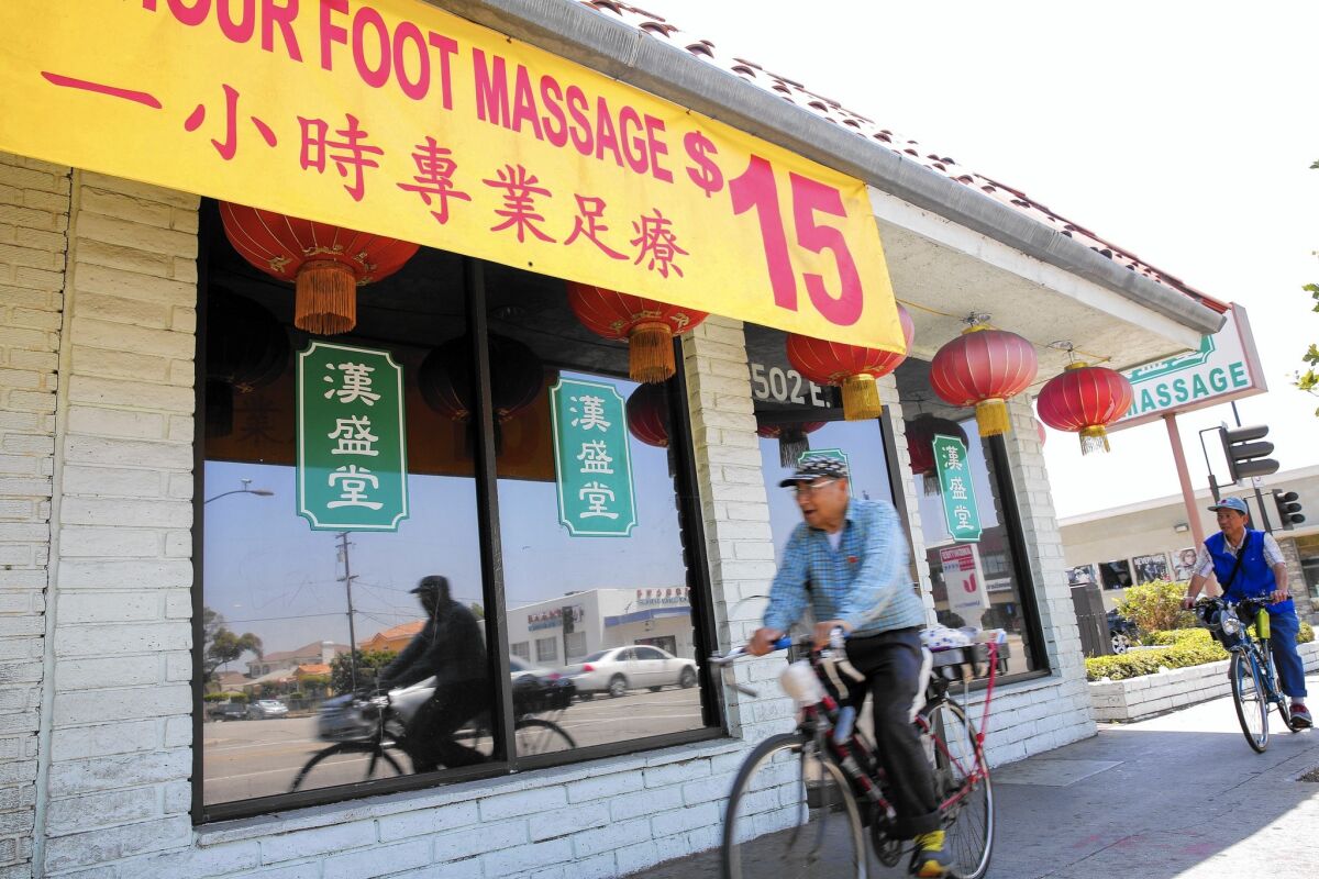 Massage parlors have flourished in the San Gabriel Valley. California cities are weighing how to regulate such businesses.