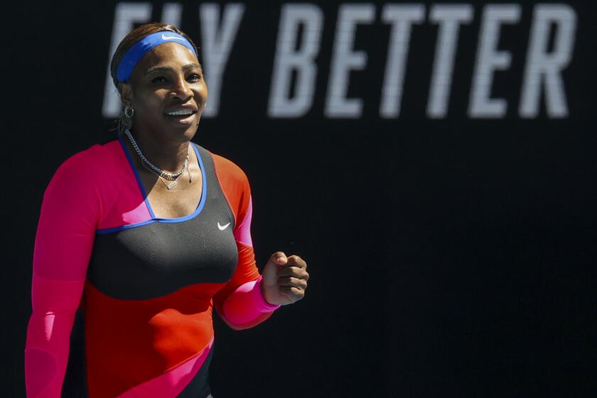 Serena Williams celebrates after winning her fourth-round match against Aryna Sabalenka on Feb. 14, 2021.
