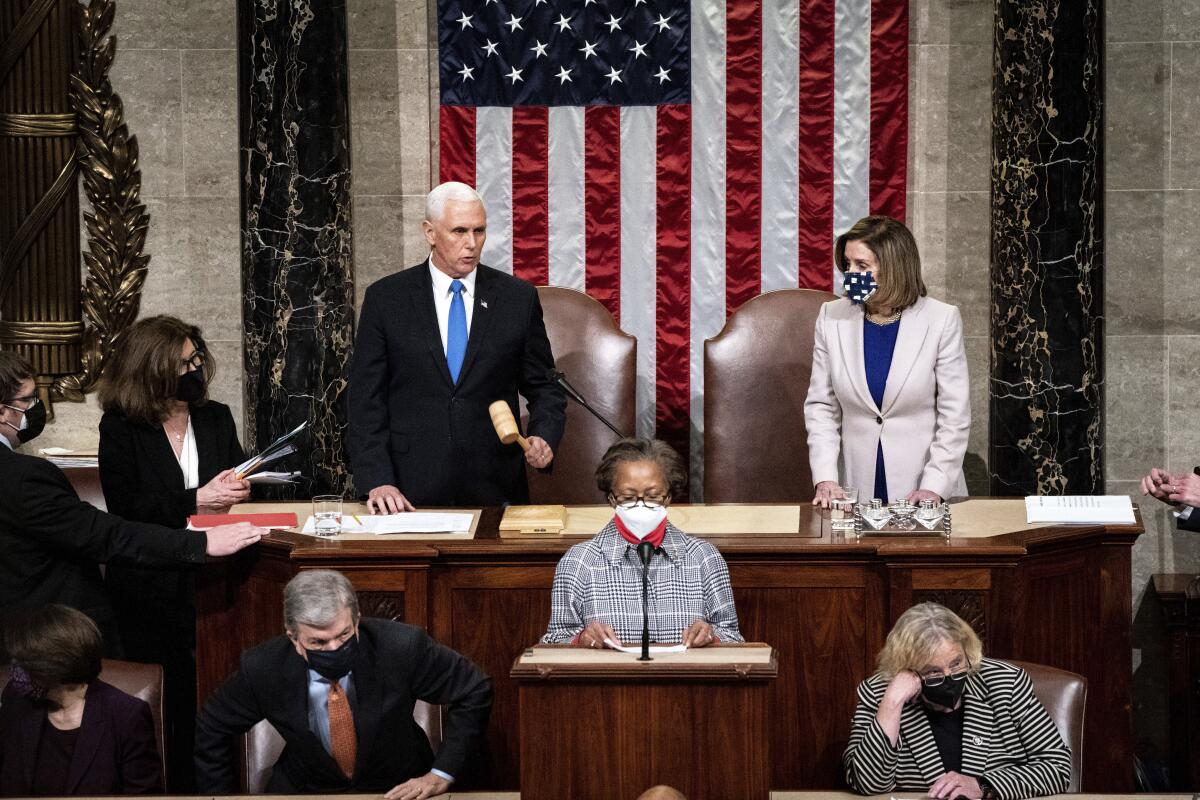 Vice President Mike Pence and Speaker of the House Nancy Pelosi officiate a joint session of Congress.