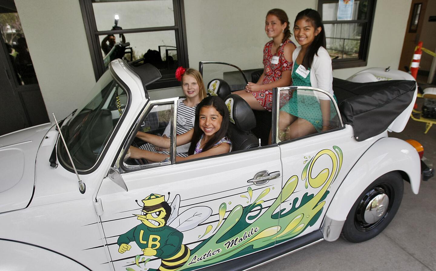 Clockwise from driver's seat are Julia Terrano, Gabija Petrulis, Cheyenne Arroyo and Hannah Macaranas, team coordinators who helped restore this 1979 VW Beetle, a student science class project at Luther Burbank Middle School in Burbank on Thursday, April 4, 2013. The science classes at the school helped restore the car and coordinated community members to finish restoring the 1979 VW beetle. Warner Bros. Studios, Ghost Light Industries and Burbank Arts for All were instrumental in the restoration.