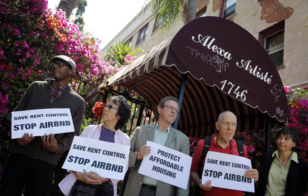In July, housing and labor activists protest Airbnb at a Hollywood apartment building that they say is being used for short-term rentals.