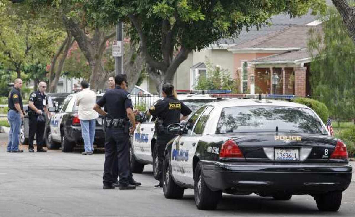 Burbank Police finish up at the scene of a shooting on the 400 block of South Lamer St. on Thursday, July 12, 2012.
