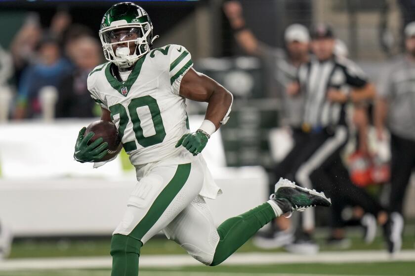 New York Jets running back Breece Hall (20) carries the ball against the Buffalo Bills during the second quarter of an NFL football game, Monday, Sept. 11, 2023, in East Rutherford, N.J. (AP Photo/Seth Wenig)