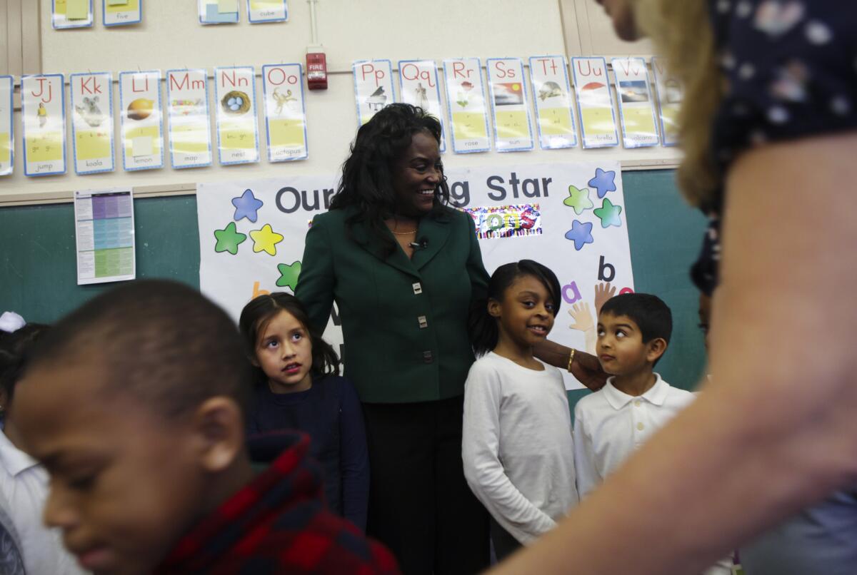 L.A. Unified Supt. Michelle King visits Century Park Elementary School. With her are students Darrell Bainton, front left, Valery Lopez, Anyah Robinson and Erik Rodriguez.