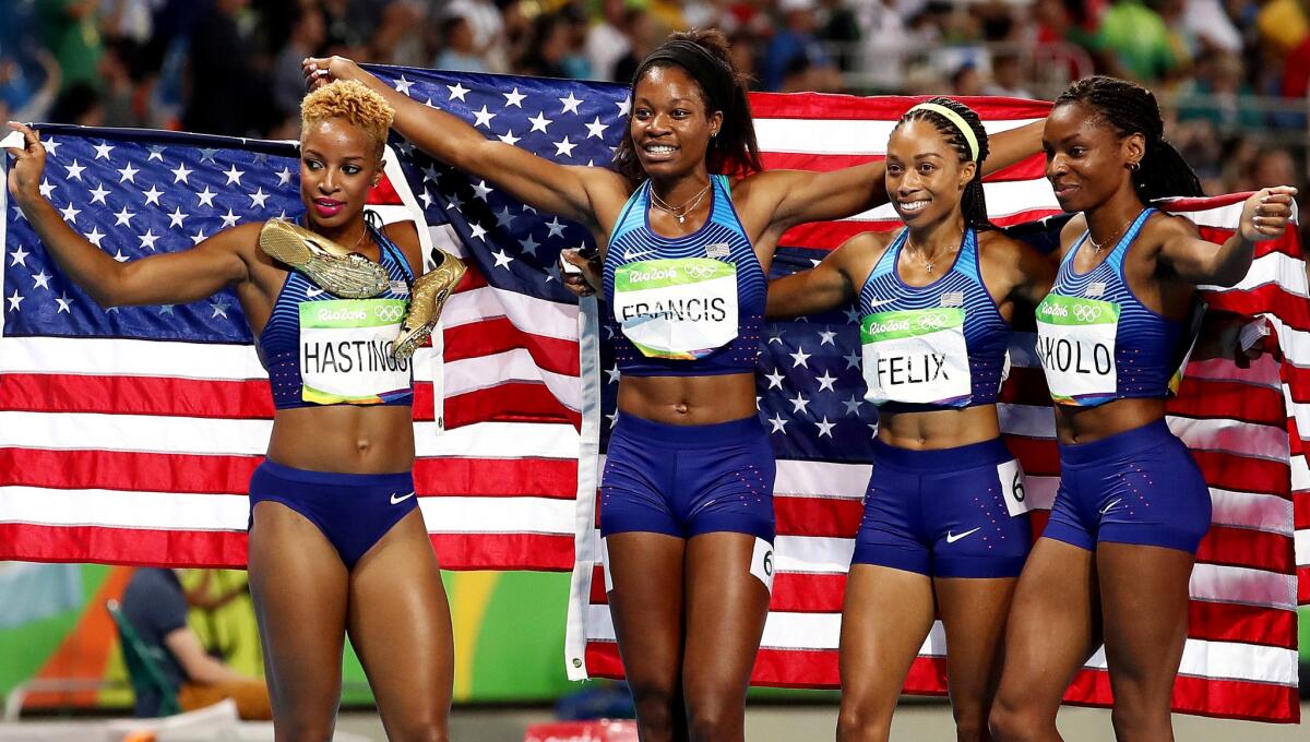 The U.S. women's 1,600-meter relay team -- Natasha Hastings, from left, Phyllis Francis, Allyson Felix and Courtney Okolo -- celebrate after winning gold on Saturday.