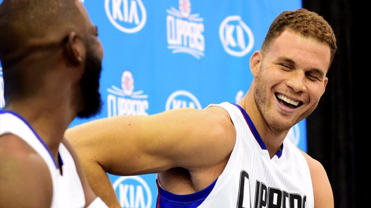 Forward Blake Griffin laughs with guard Chris Paul at the Clippers' media day on Sept. 26.