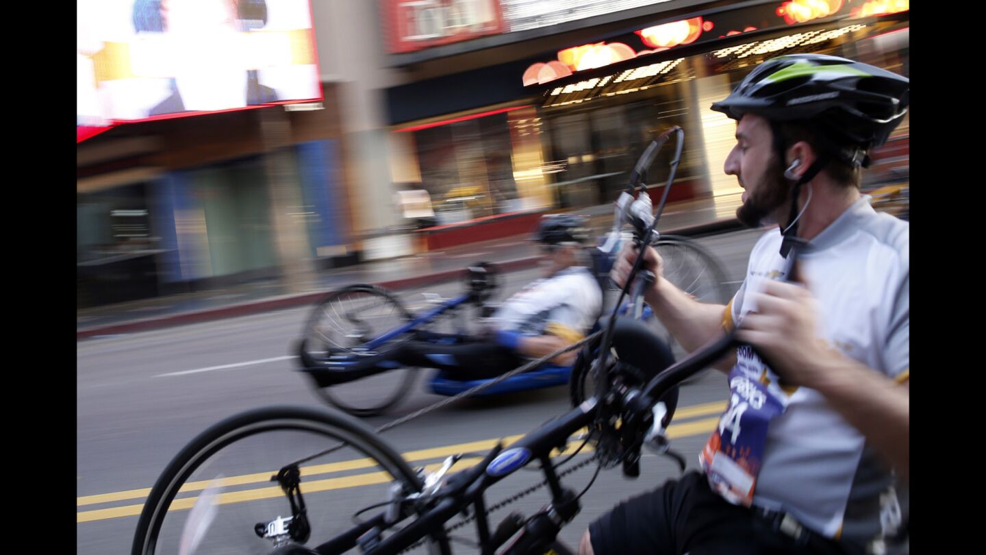 Hand cyclists along Hollywood Blvd. during the 30th Los Angeles Marathon on Sunday.