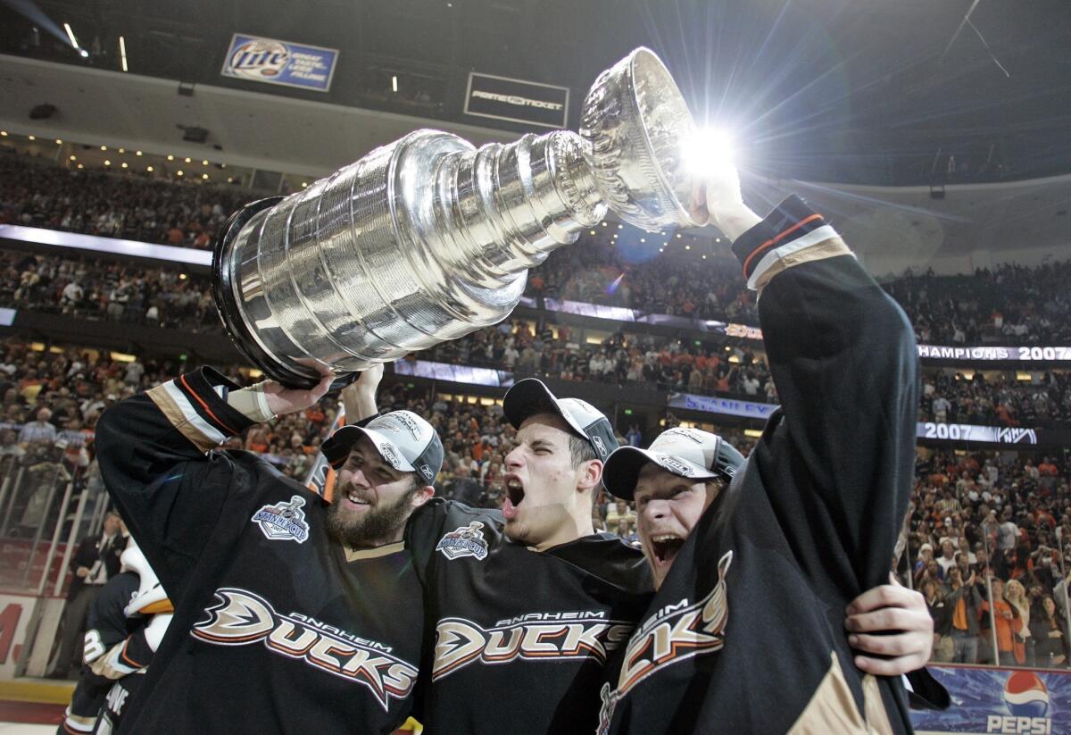 Dustin Penner, Ryan Getzlaf and Corey Perry celebrate the Ducks' Stanley Cup victory in 2007. The trio will formally reunite Thursday when Penner takes part in his first Ducks camp in six years.