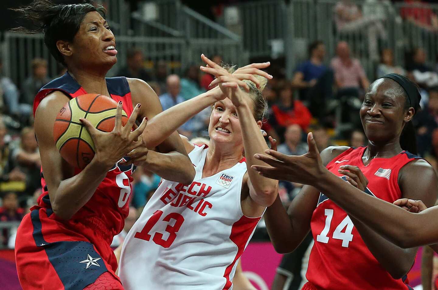 U.S. forward Angel McCoughtry rips the ball away from the Czech Republic's Petra Kulichova during a preliminary match, which the U.S. won 88-61.