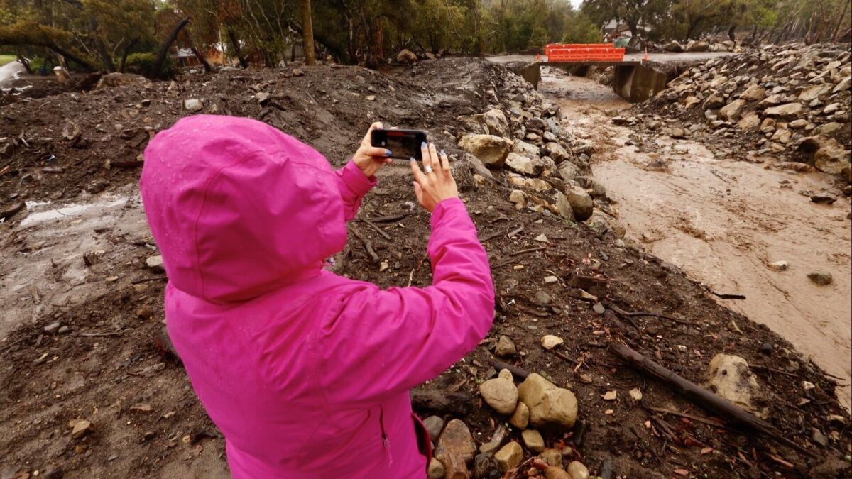 CNN correspondent Stephanie Elam takes a cellphone video of San Ysidro Creek and a bridge at East Valley Road in Montecito following a devastating mudslide there earlier this year.