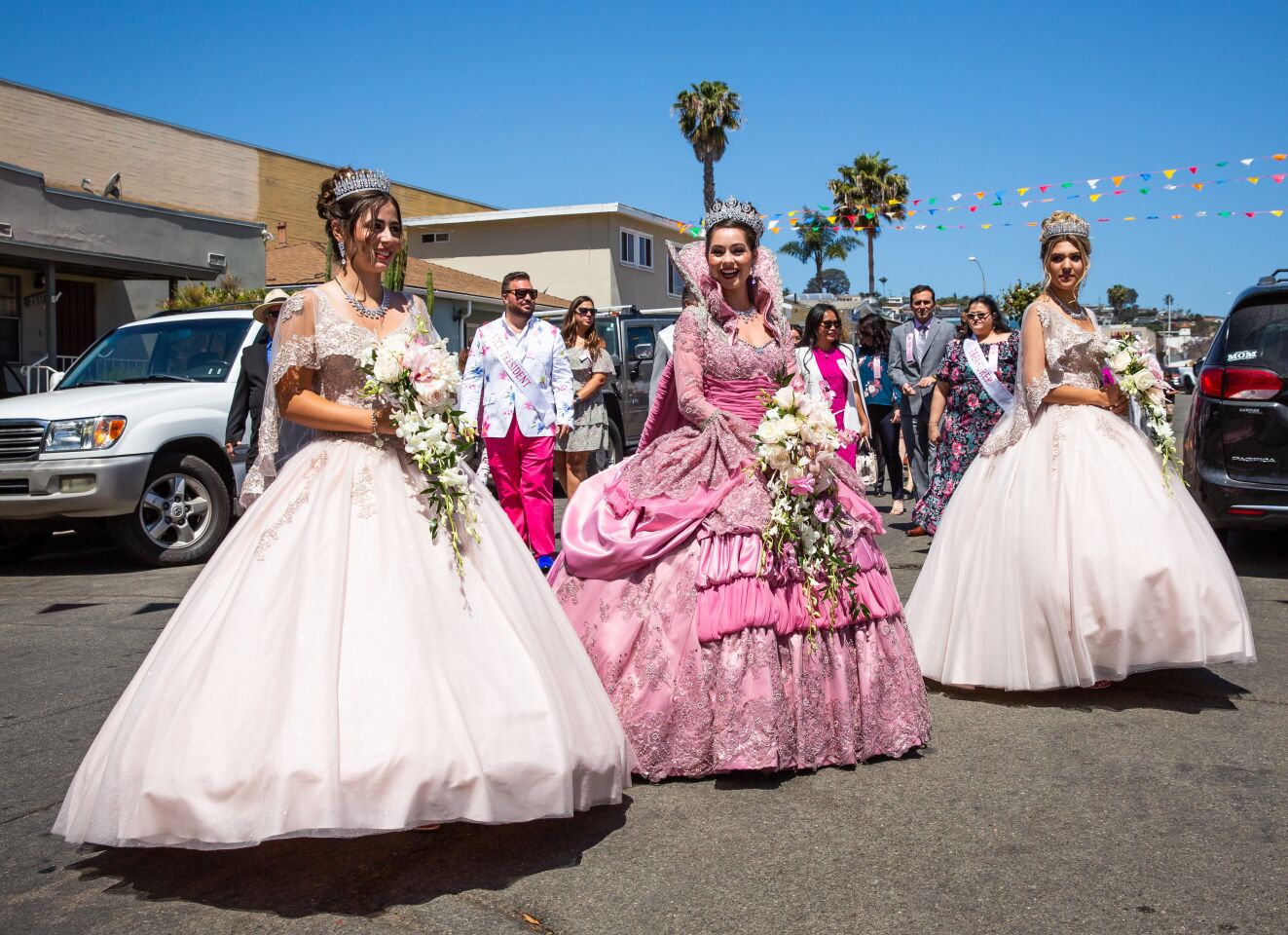 Festa Queen Jaquelyn Neves (center) and her court, Victoria Jorge (left) and Berlyn Balelo arrive for Festa do Espirito Santo (Feast of the Holy Spirit) ceremonies May 23 at the United Portuguese Society of the Holy Spirit in Point Loma.