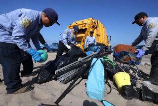 PLAYA DEL REY, CA - AUGUST 22, 2024 - Los Angeles County Beaches and Harbors workers clean-up up homeless encampment on Dockweiler State Beach in Playa del Rey on August 22, 2024. (Genaro Molina/Los Angeles Times)