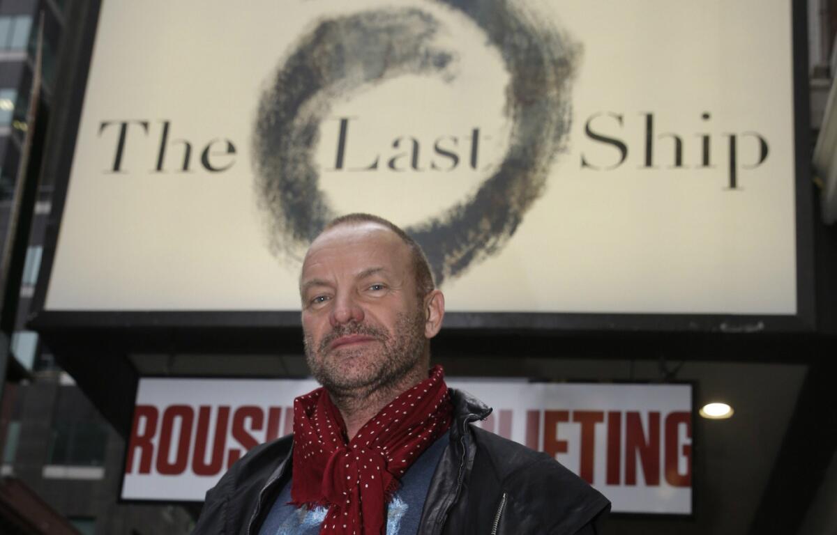 Sting stands under the marquee of "The Last Ship" at the Neil Simon Theatre in New York.