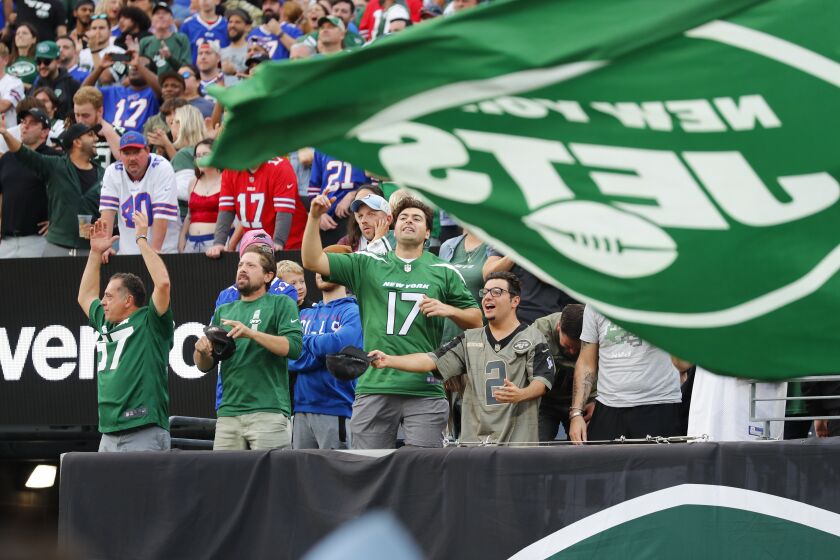 New York Jets fans cheer during the second half of an NFL football game against the Buffalo Bills, Sunday, Nov. 6, 2022, in East Rutherford, N.J. (AP Photo/Noah K. Murray)