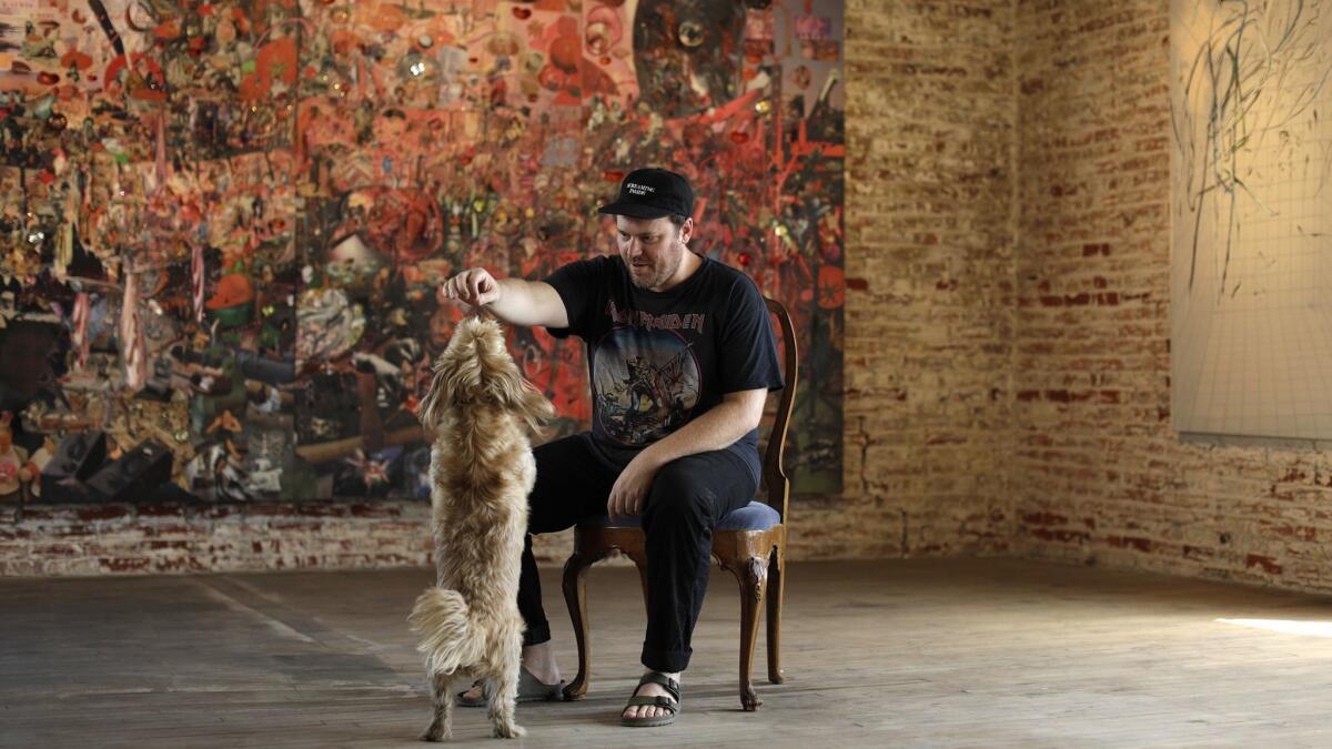 Artist Elliott Hundley, photographed at his studio in Los Angeles with his dog Spicoli.