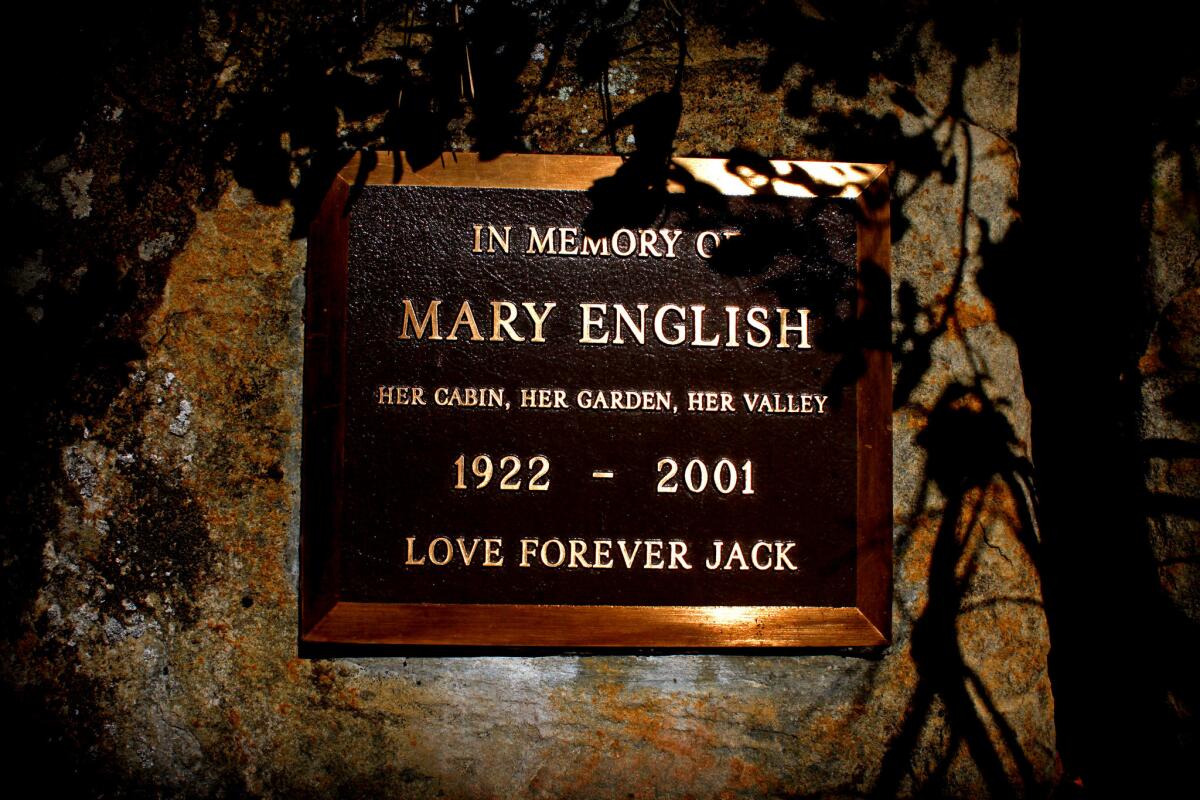 English mounted a plaque in honor of his wife, Mary, on a rock between his workshop and the cabin. (Barbara Davidson / Los Angeles Times)