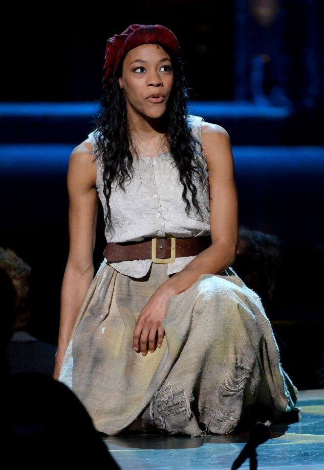 Nikki M. James performs onstage with the cast of "Les Miserables."