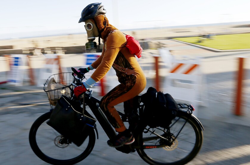 Daniel Rogerson wears a vintage military gas mask in Santa Monica.