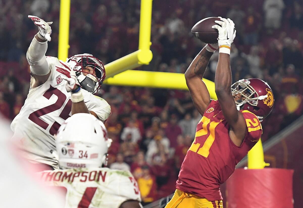 USC receiver Tyler Vaughns catches a two-point conversion in front of Washington State safety Skyler Thomas in the fourth quarter Friday.