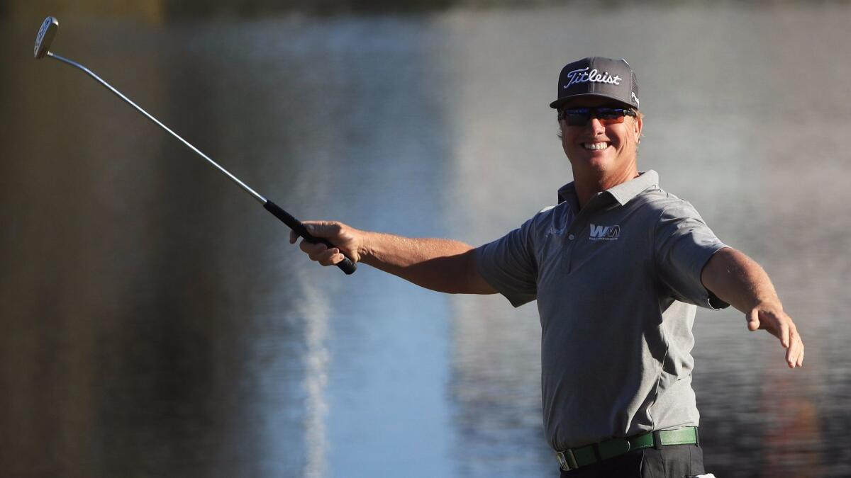 Charley Hoffman is all smiles after sinking a putt at No. 18 for his third consecutive birdie during the third round of the Arnold Palmer Invitational on Saturday.