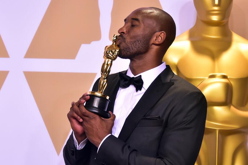 TOPSHOT - Kobe Bryant poses in the press room with the Oscar for Best Animated Short Film for "Dear Basketball," during the 90th Annual Academy Awards on March 4, 2018, in Hollywood, California. (Photo by FREDERIC J. BROWN / AFP) (Photo credit should read FREDERIC J. BROWN/AFP via Getty Images)