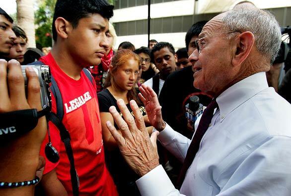 L.A. Unified School District Supt. Ramon C. Cortines, right, speaks with students who converged on the school district's downtown headquarters to protest looming teacher layoffs.