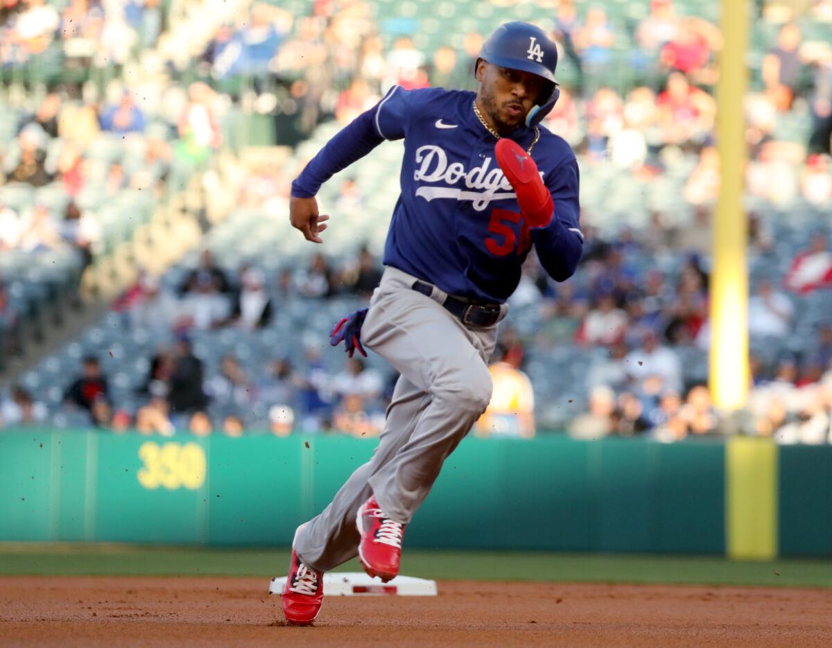 Dodgers outfielder Mookie Betts rounds second base Tuesday against the Angels.