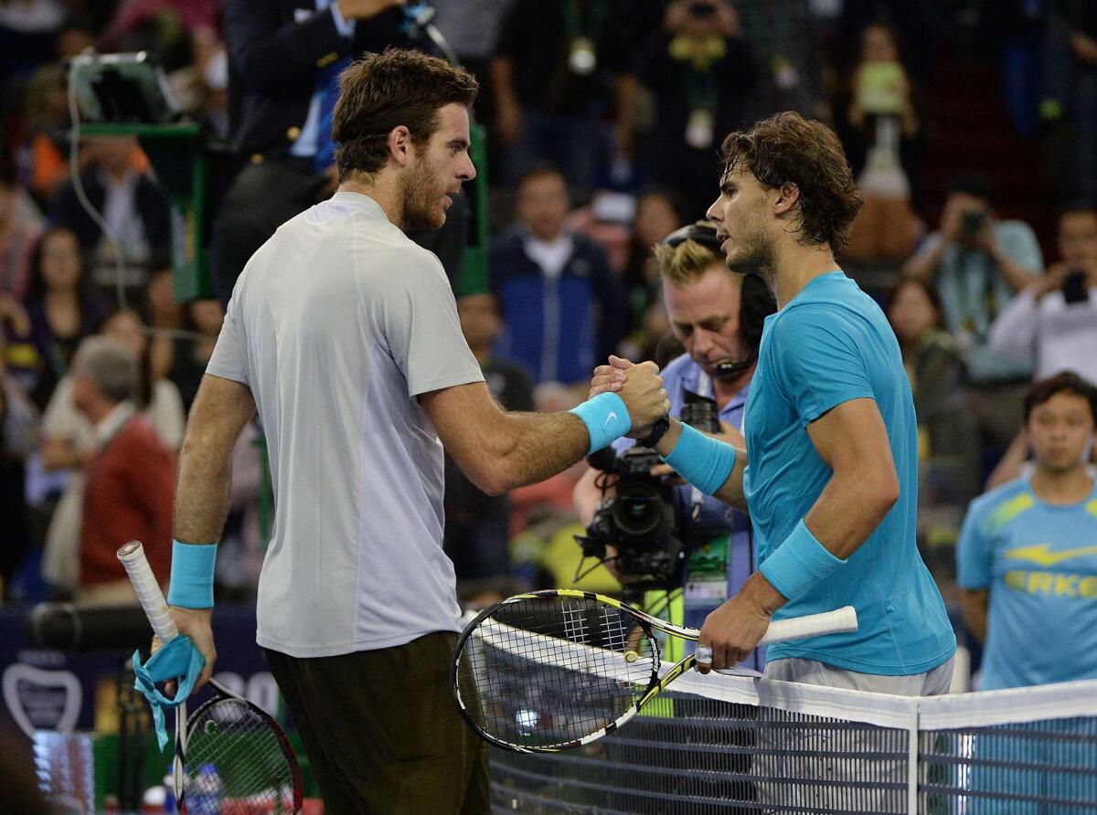 Juan Martin del Potro, left, is congratulated by Rafael Nadal after a straight-set victory in the Shanghai Masters on Saturday.
