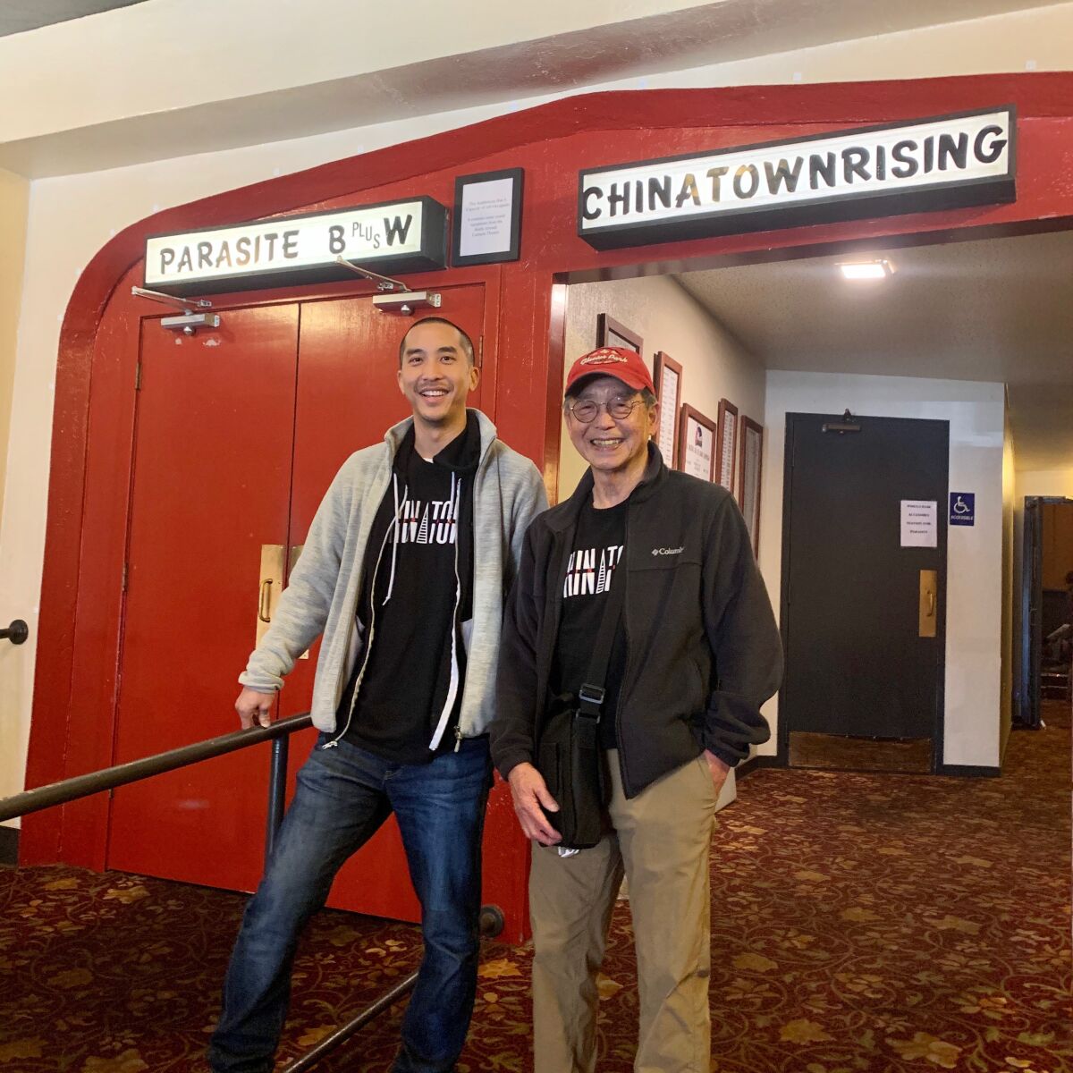 Co-directors of "Chinatown Rising," Josh, left, and Harry Chuck in the theater at one of their screenings.